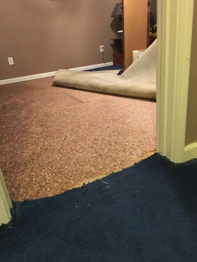 Carpet pad removal revealing water damage during Water Mitigation Services in Discovery Bay
