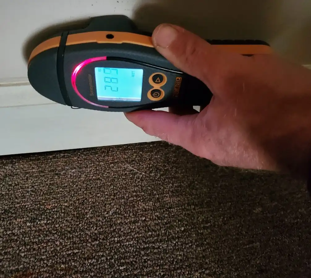 Moisture detection at baseboard during Storm Damage Restoration in Discovery Bay